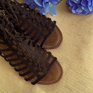 Strappy, back-zip wedge sandals.